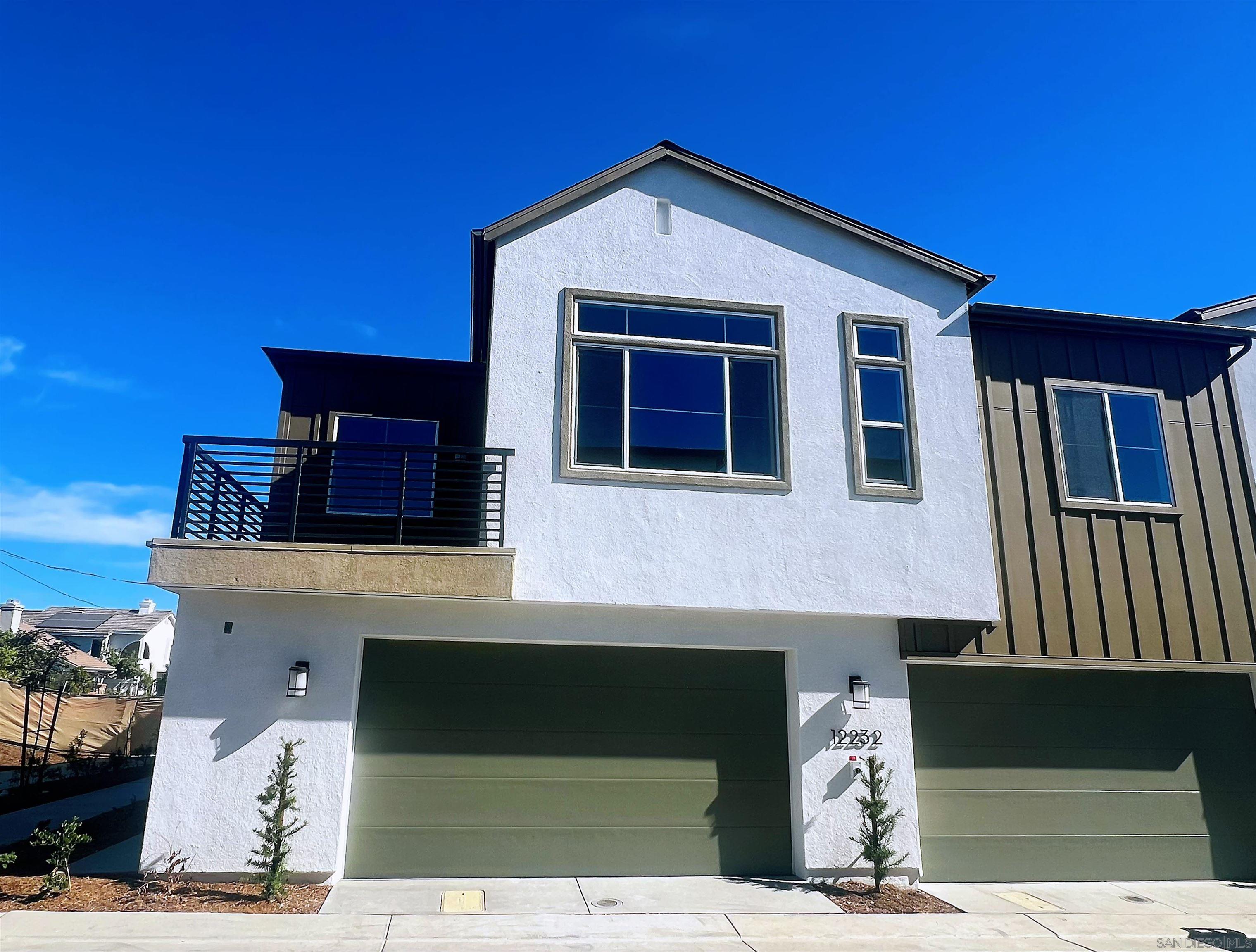 a front view of a house with a garage