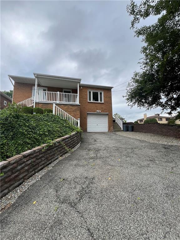 a house view with a garden space