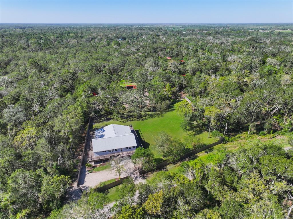 This home is nestled on a spacious five acre lot in Alvin, TX.