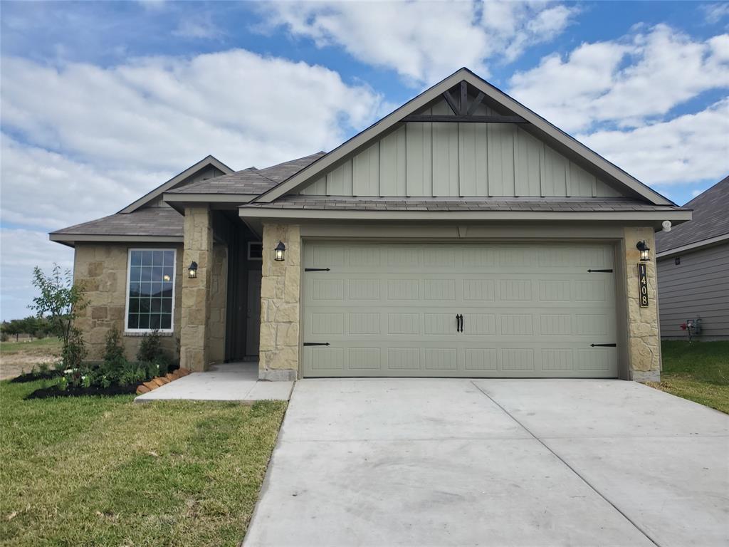 a front view of a house with garage