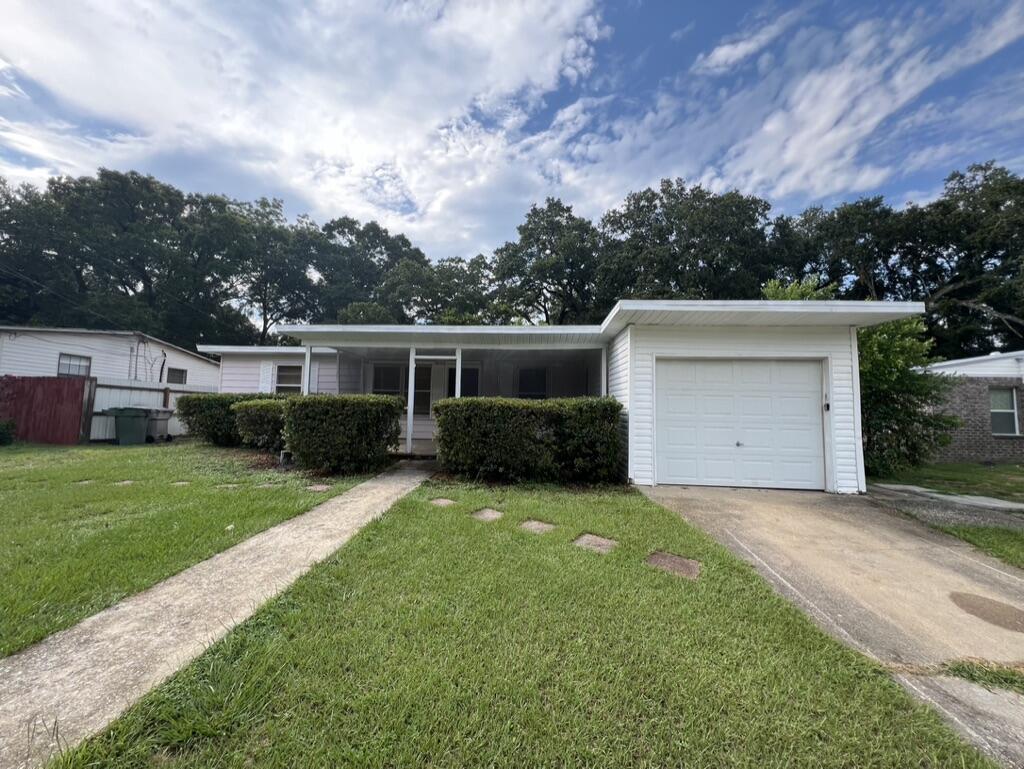 front view of a house with a yard