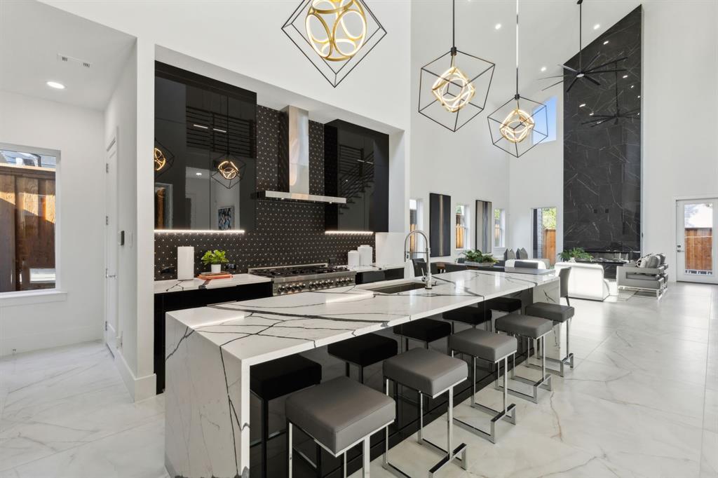 a view of a dining room with furniture and a chandelier