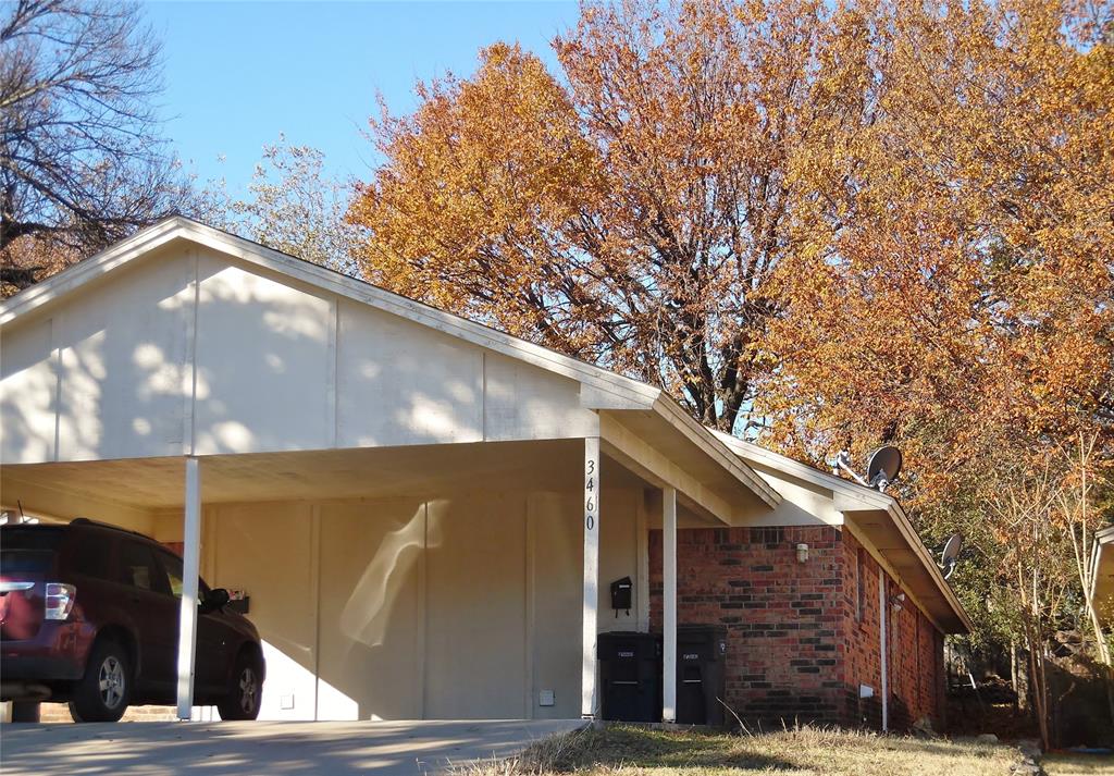 a view of a house with a tree