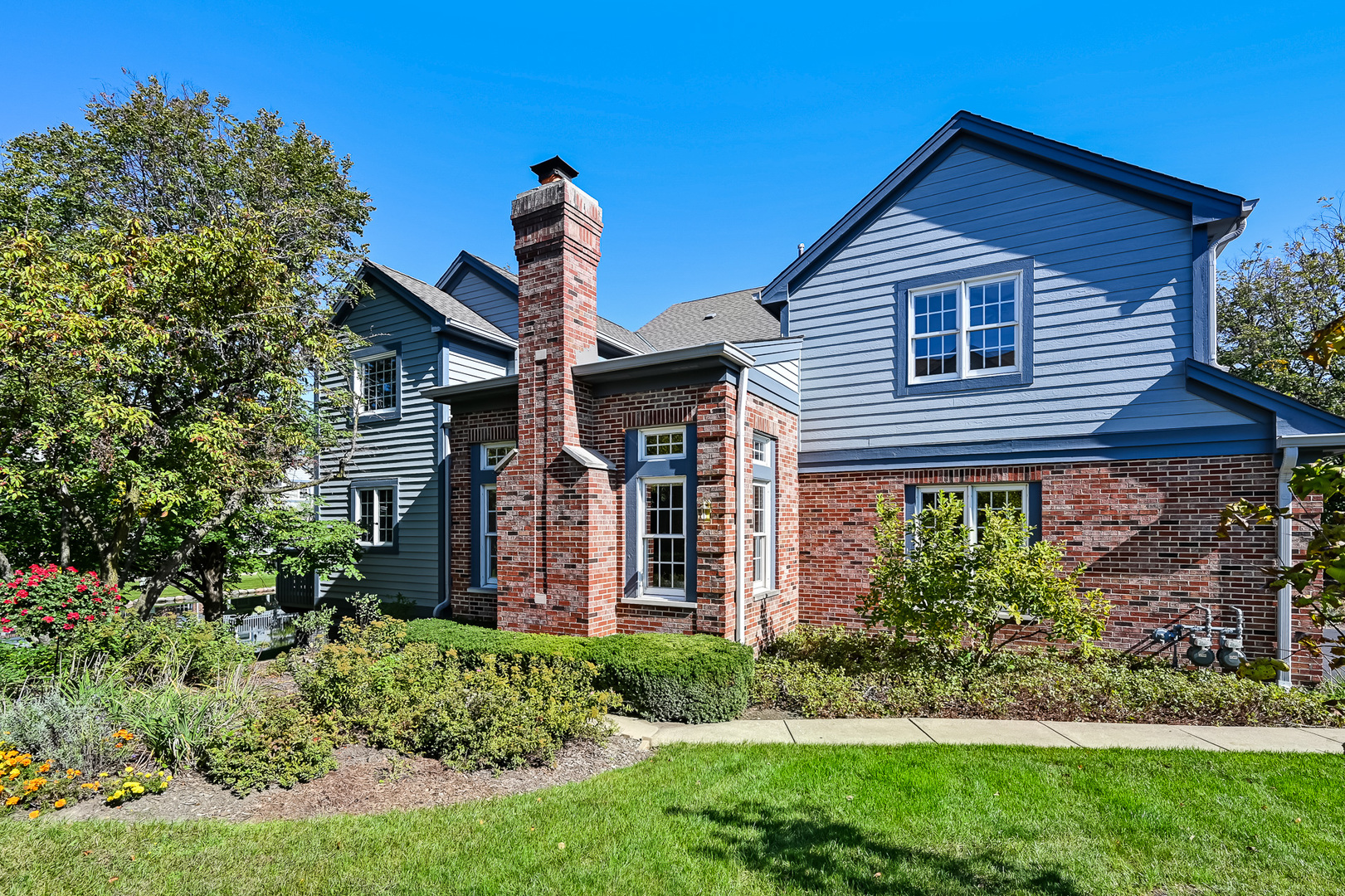 a front view of a house with garden