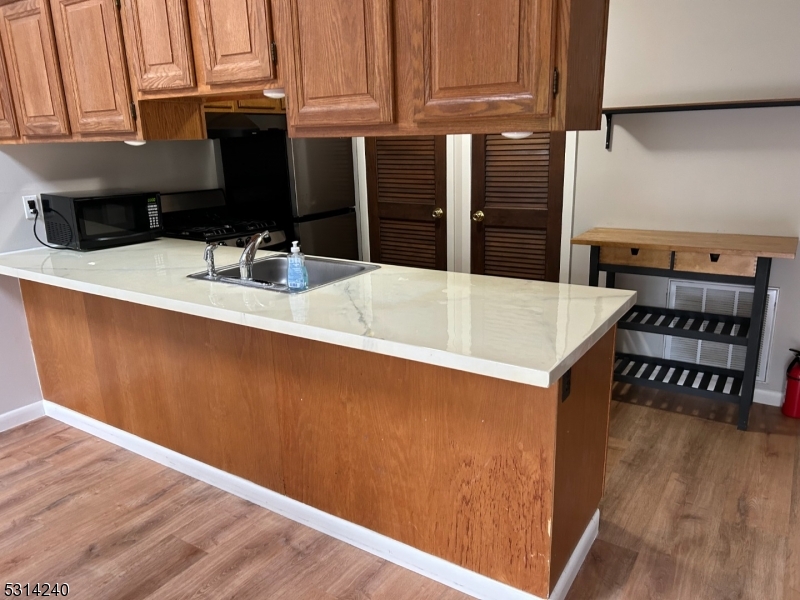 a kitchen with a sink and cabinets