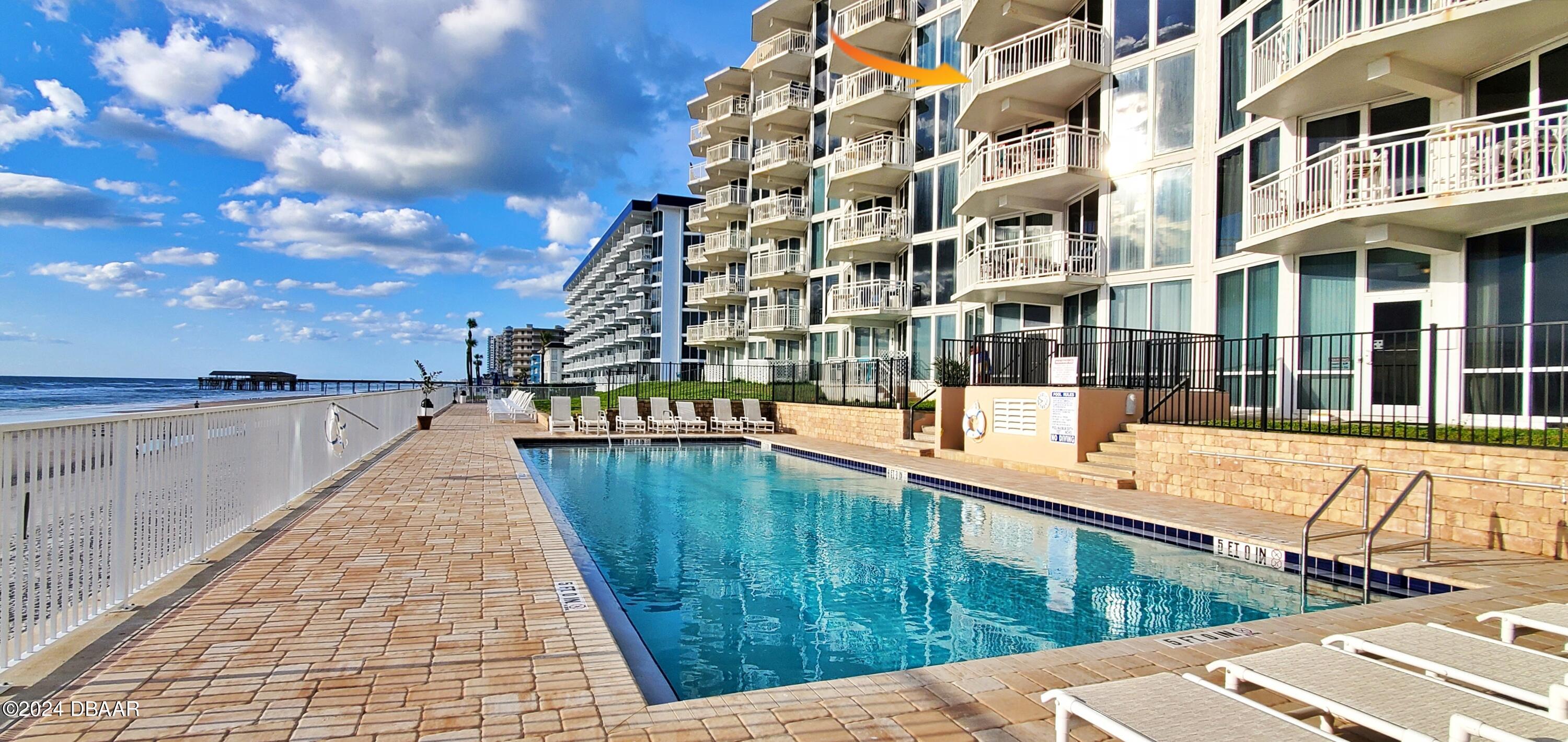 a balcony with view of an ocean view