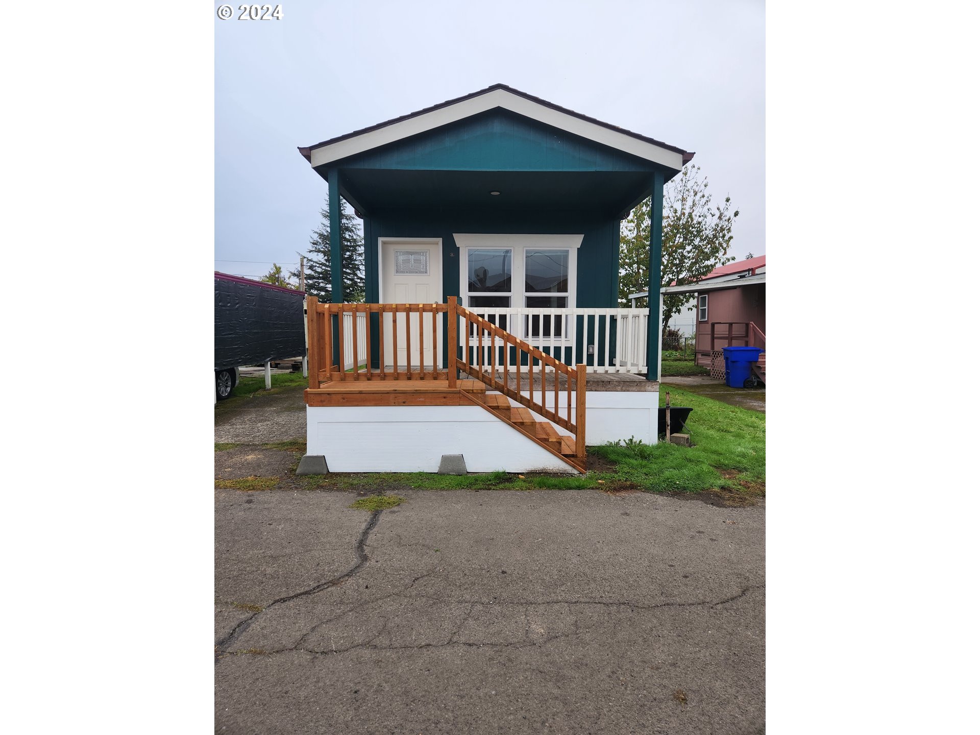 a view of a porch with a small yard