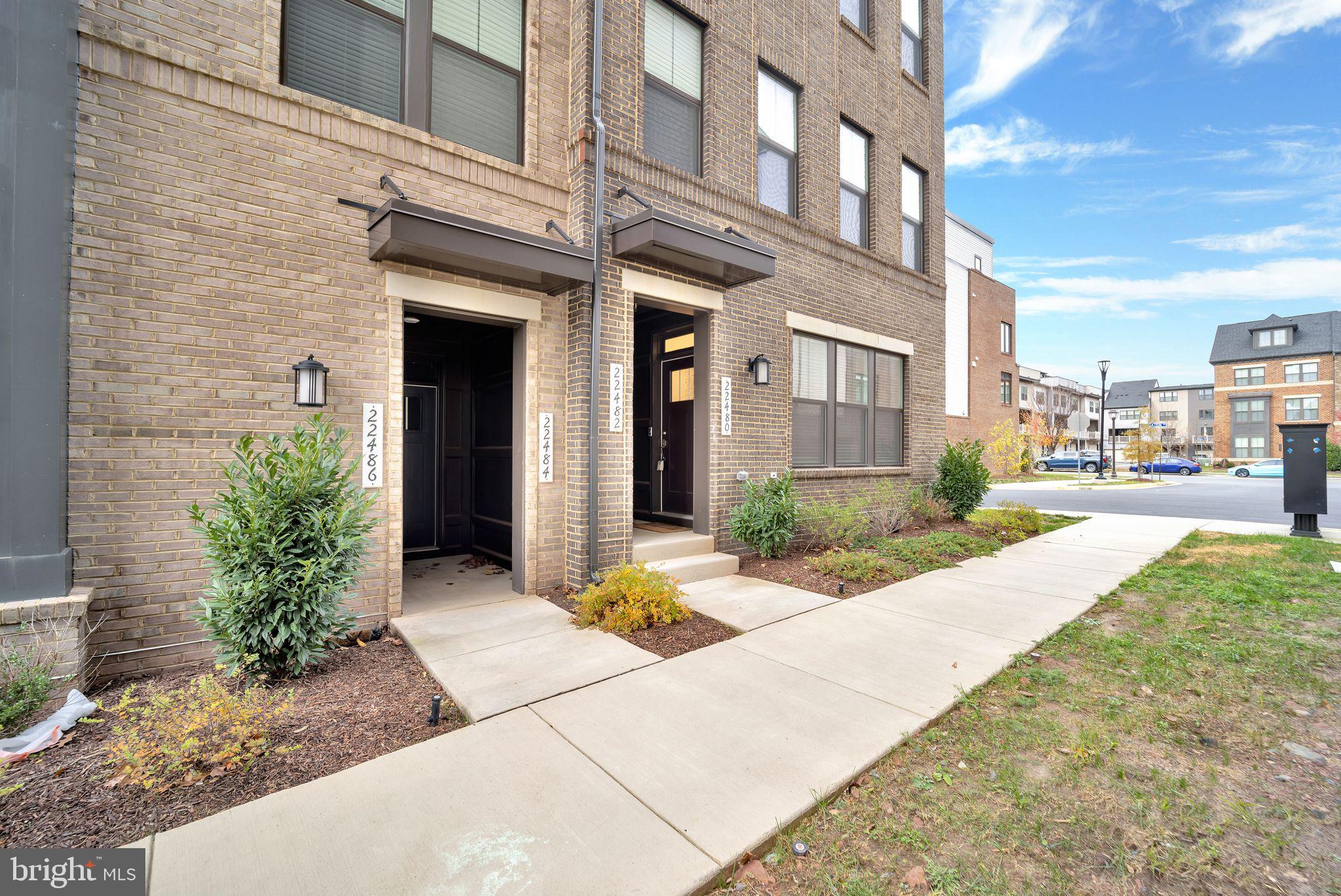 a view of a building with a yard