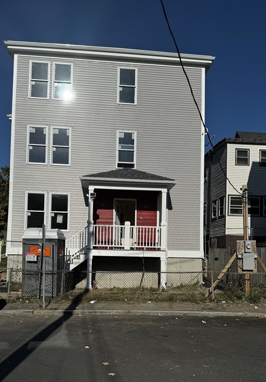 a view of a house with a bench