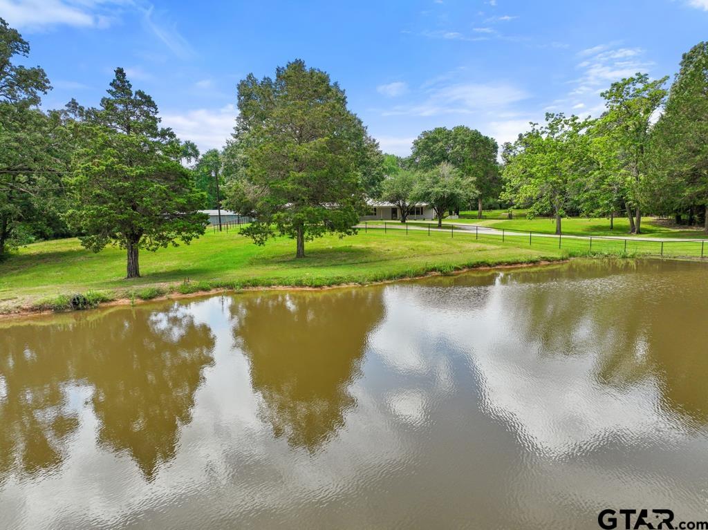 a view of a golf course with a lake