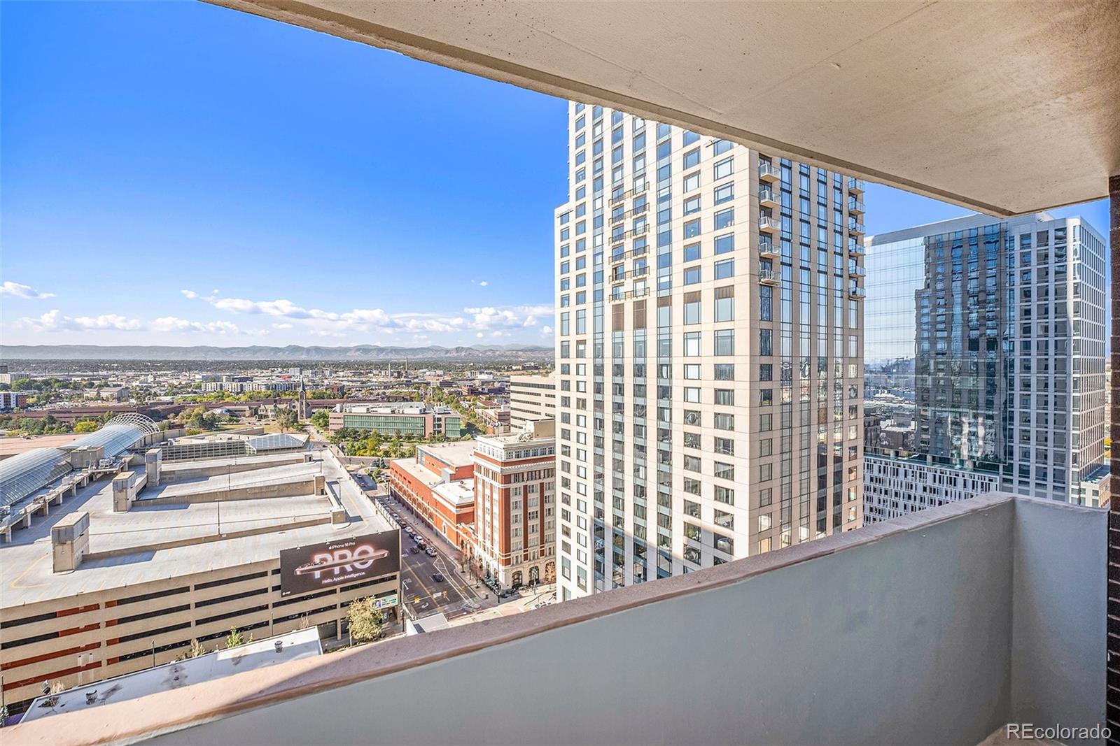 a view of a balcony with city