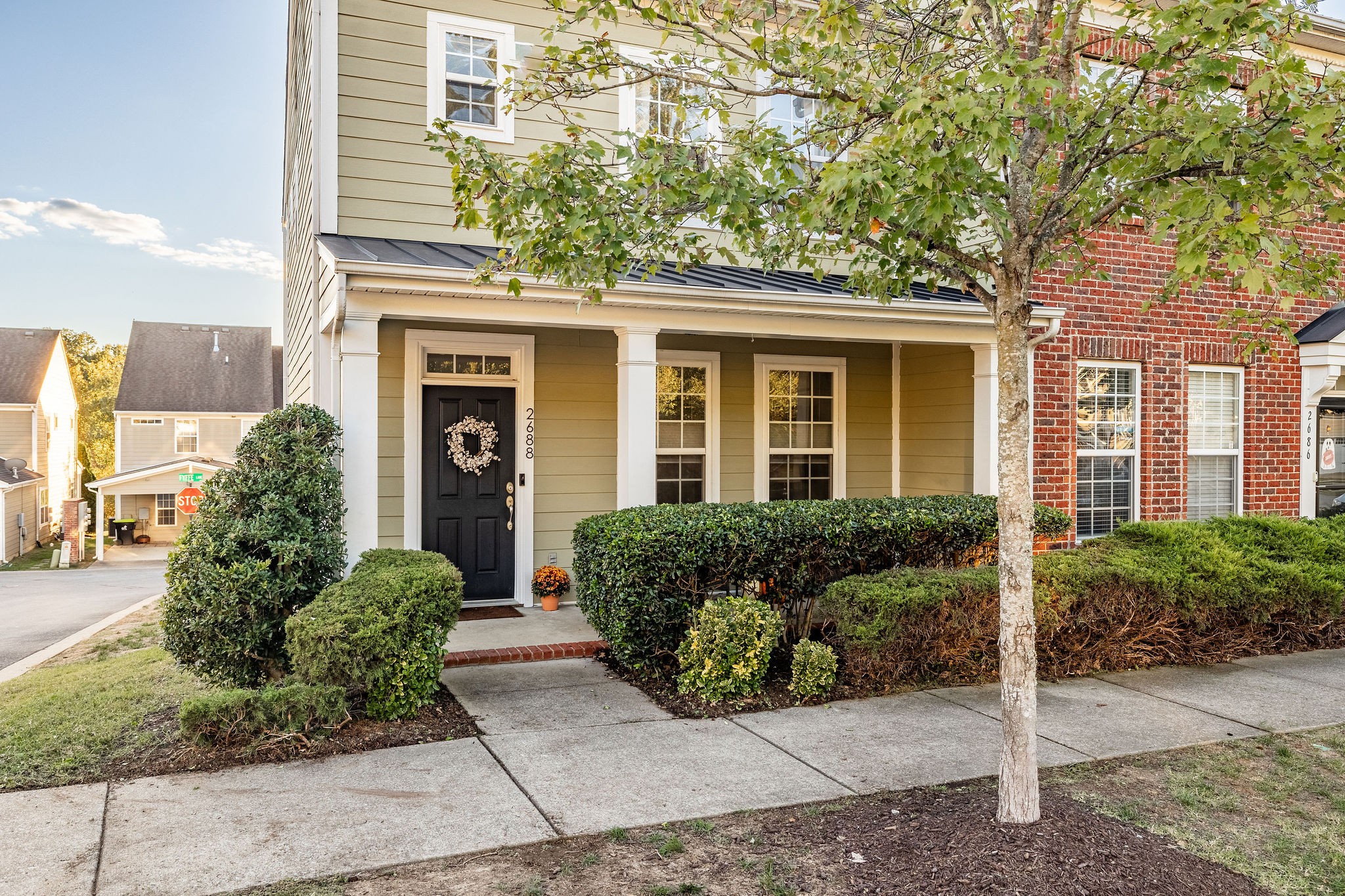 a front view of a house with garden