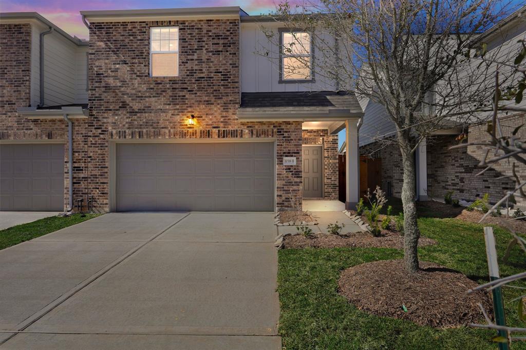 a front view of a house with yard