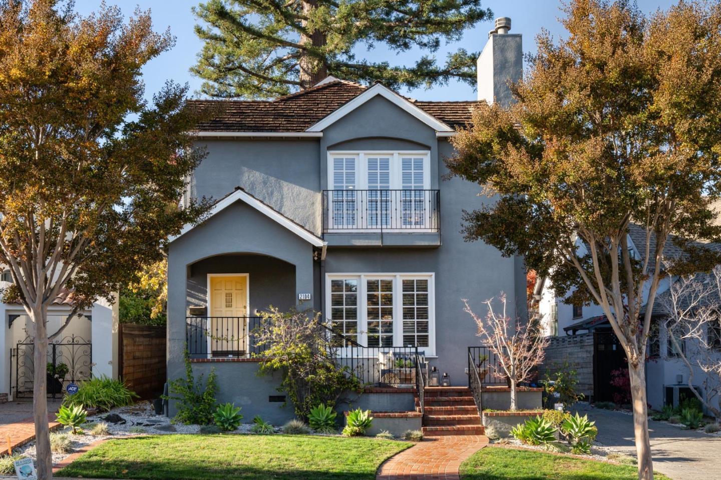 a front view of a house with garden