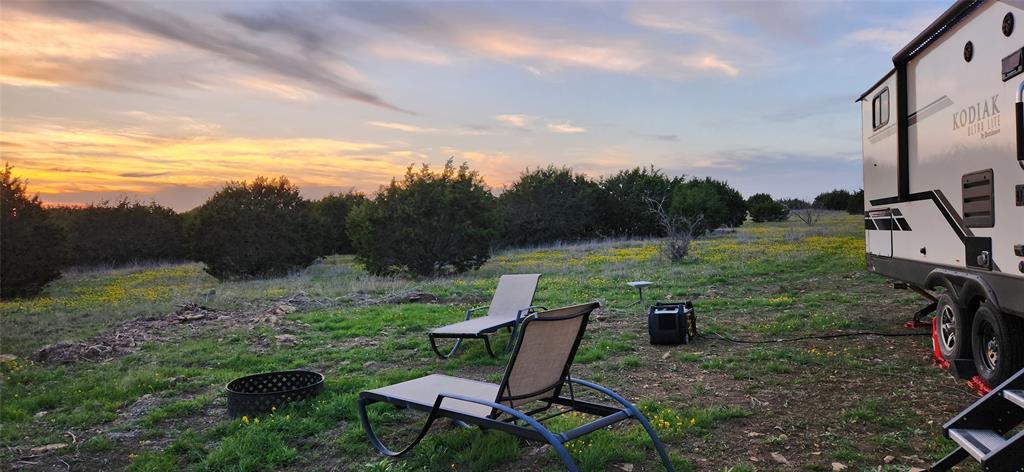 a view of a chairs in a backyard