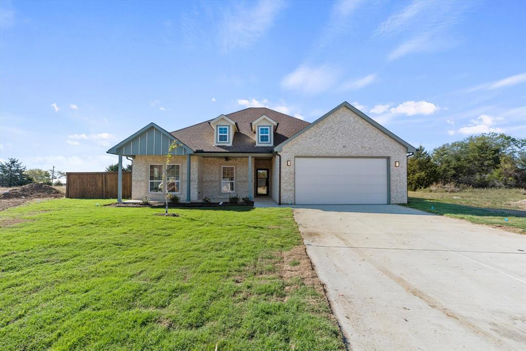 a front view of a house with yard