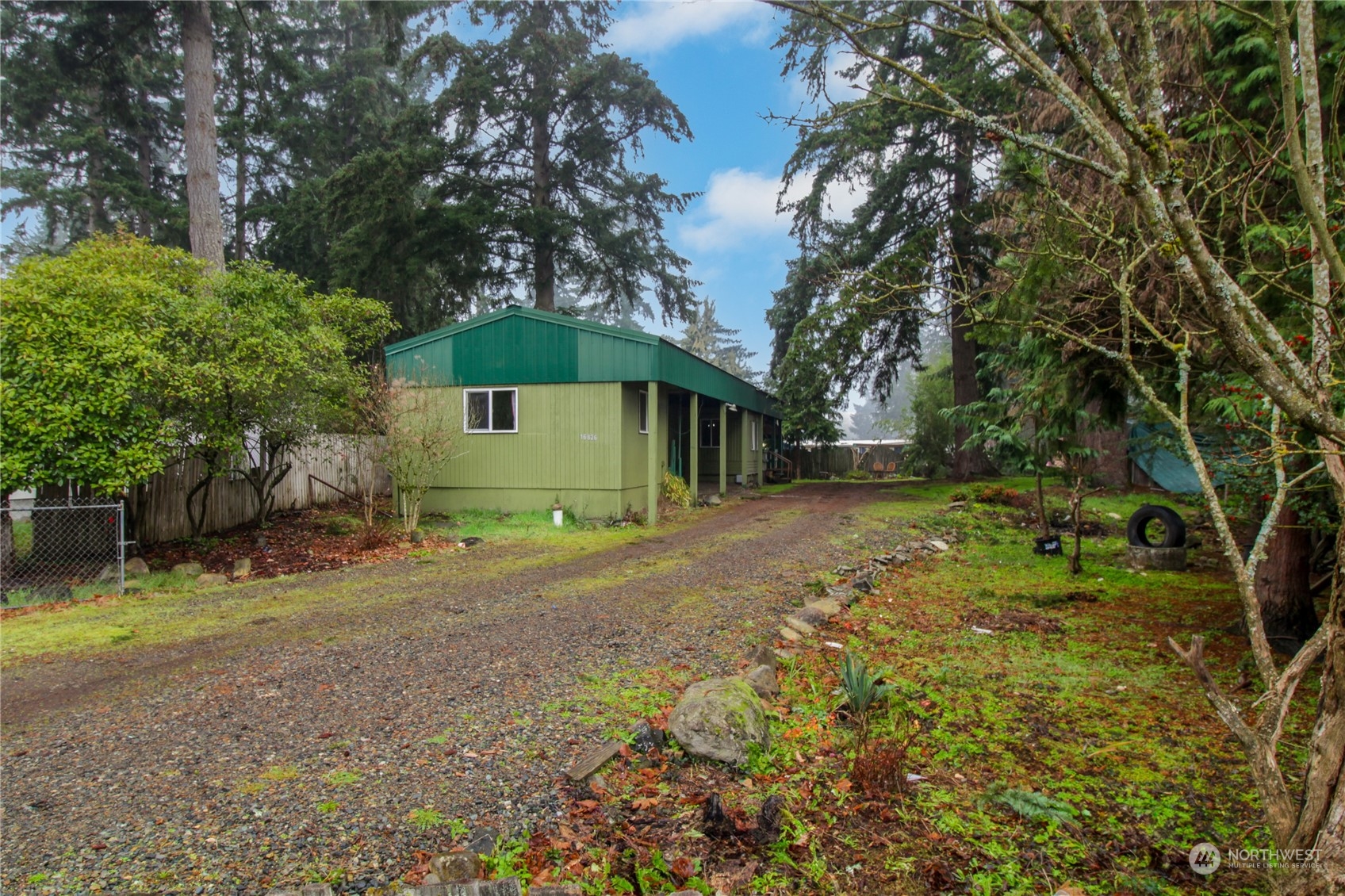 a backyard of a house with a yard and garage