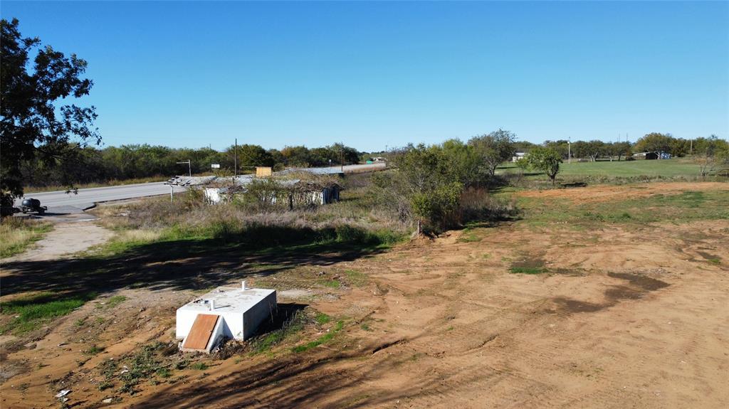 a view of a backyard of the house