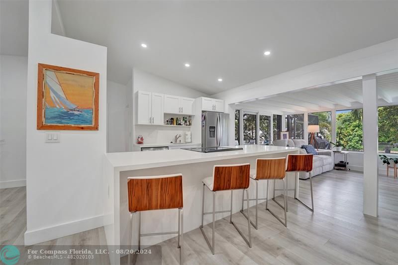 a kitchen with stainless steel appliances granite countertop a stove and a refrigerator