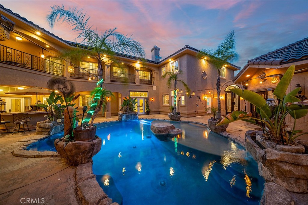 a view of a swimming pool with sitting area