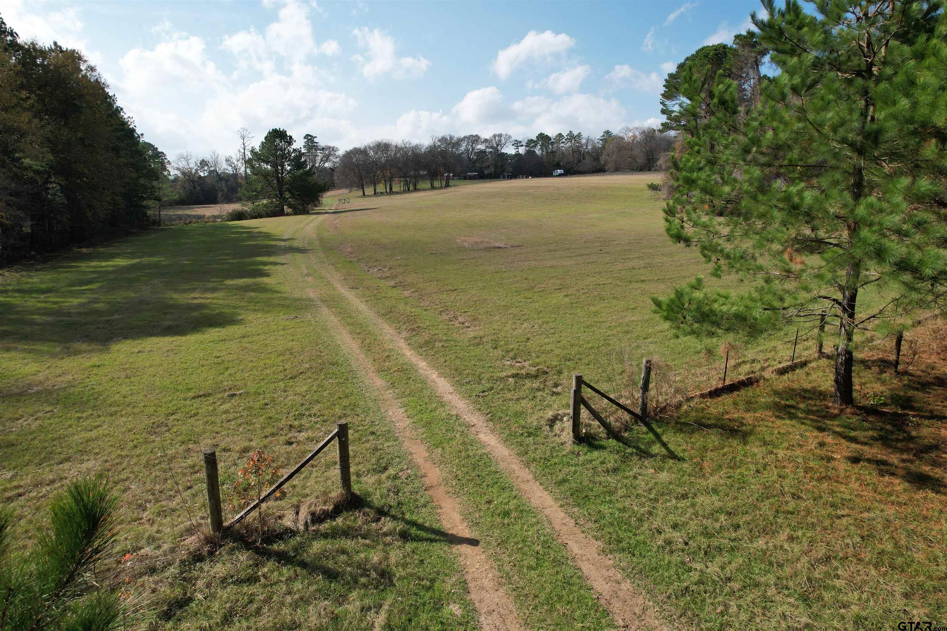 a view of a lake with a yard