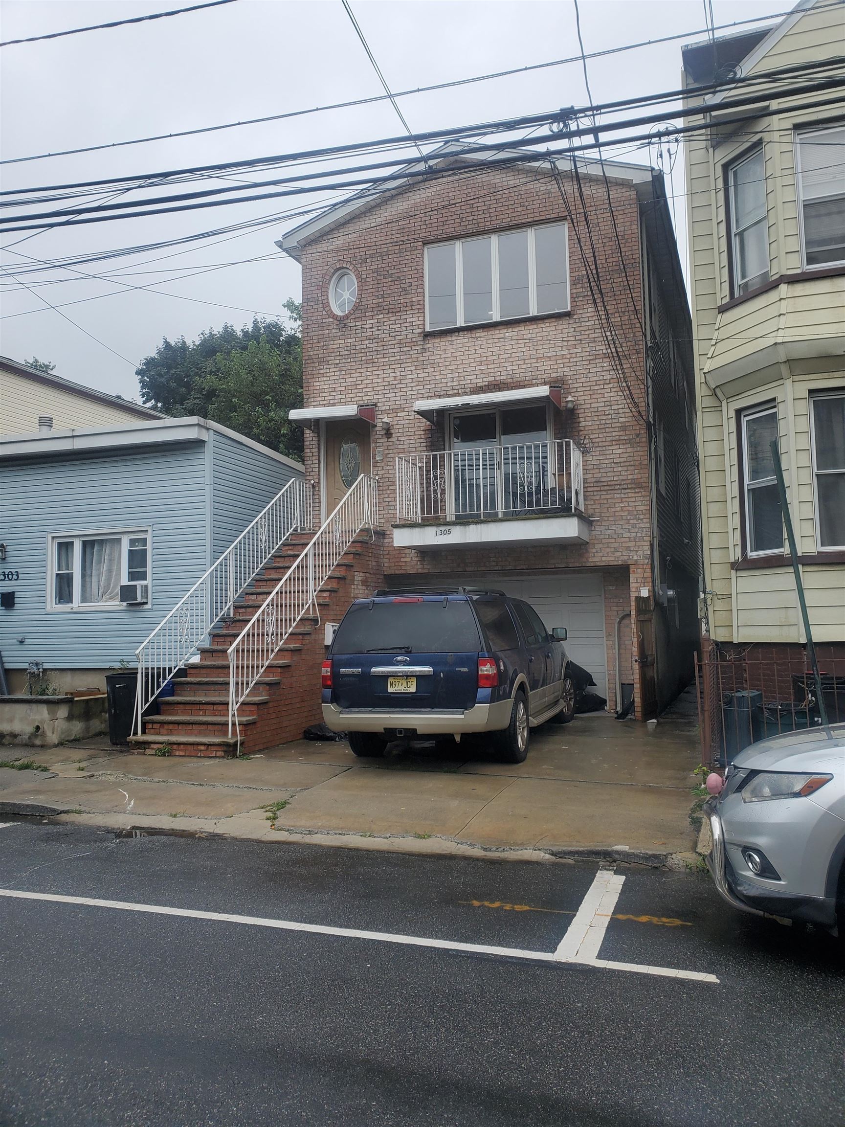 a view of a car parked in front of a house