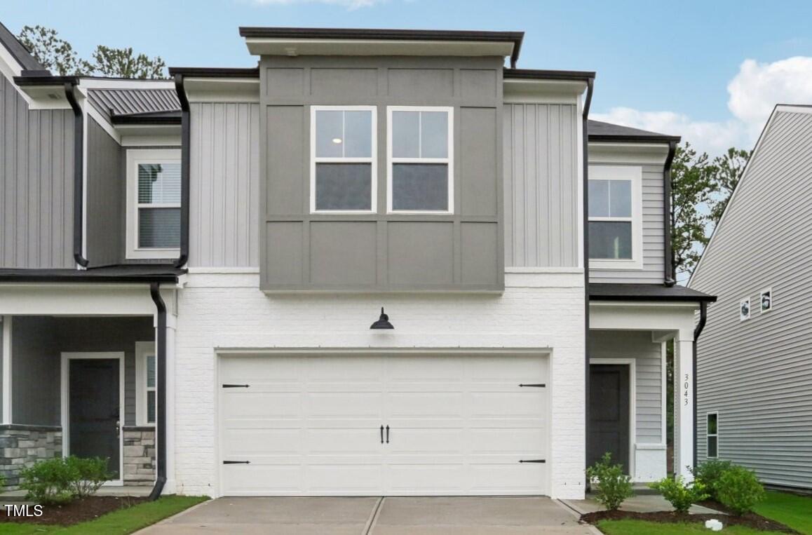 a front view of a house with a garage