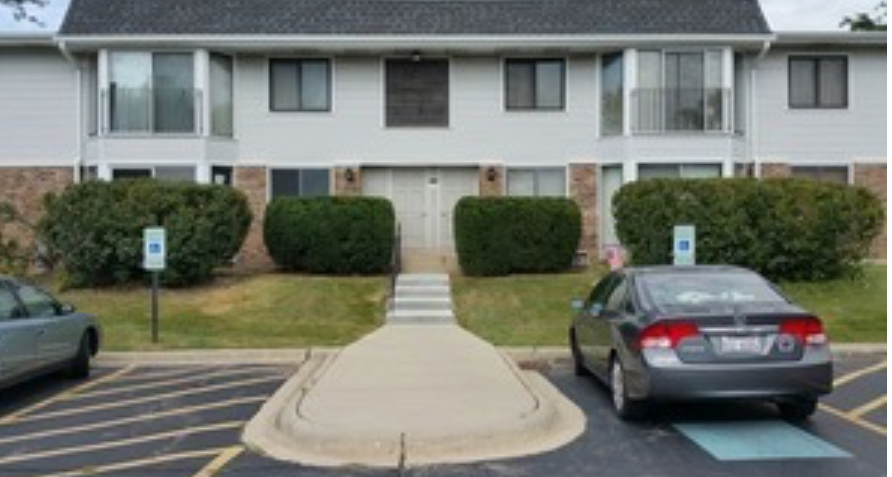 a view of a car park in front of house