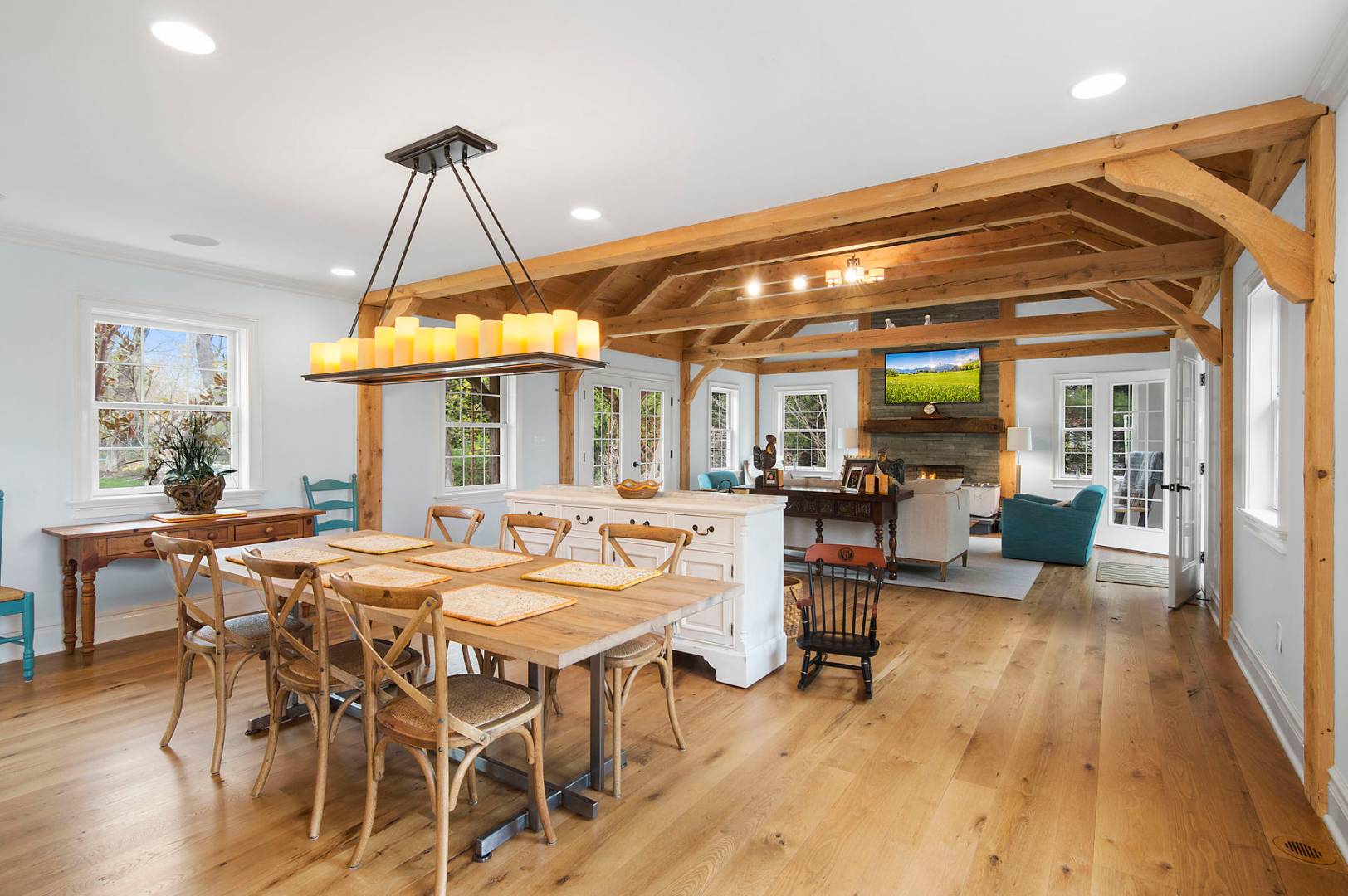 a view of a dining room with furniture and wooden floor