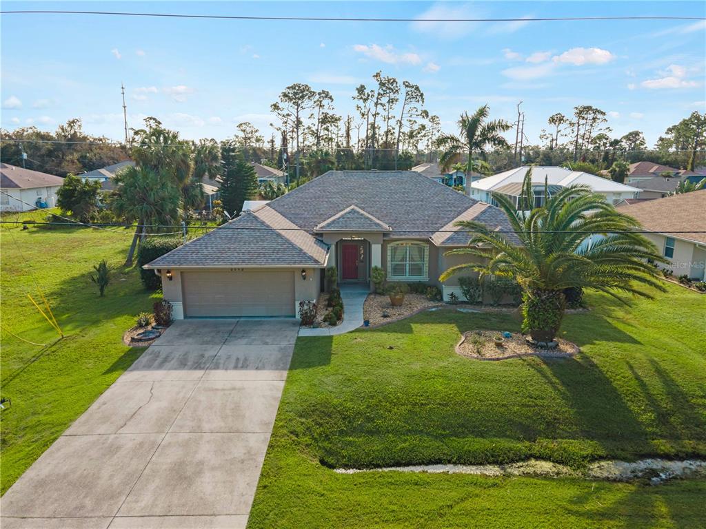 a view of a house with a yard