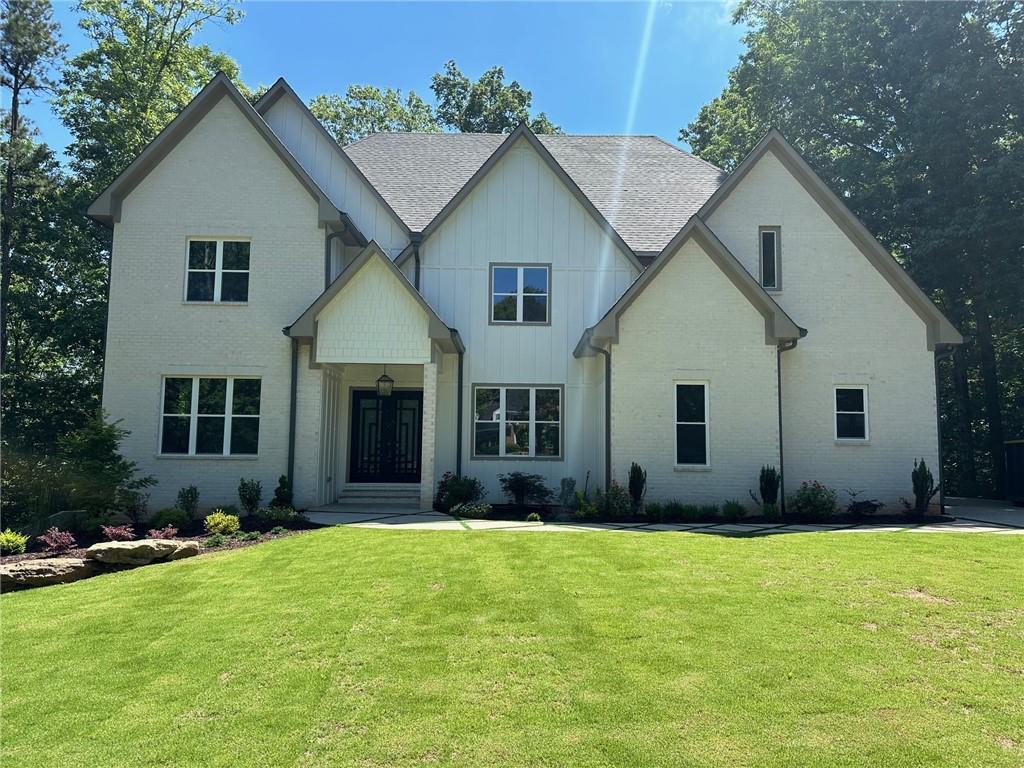 a front view of a house with a yard