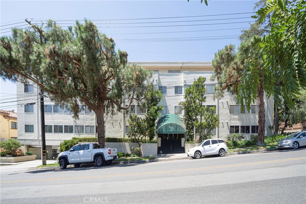 a front view of a building with street view