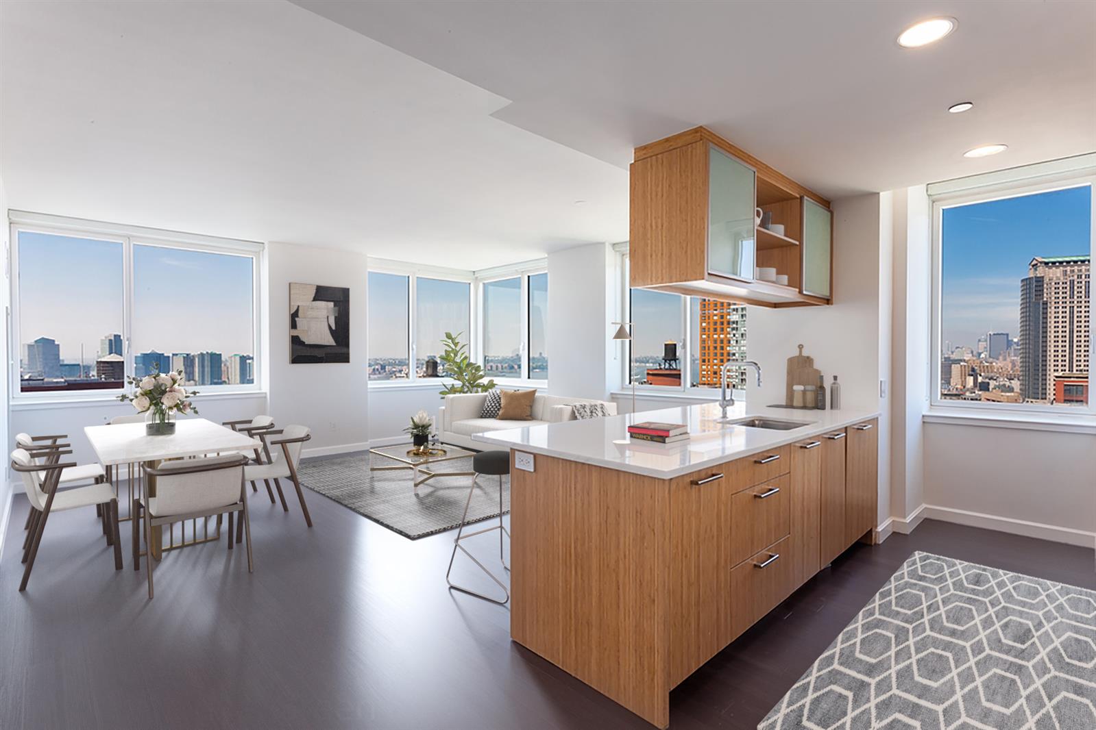 a room with stainless steel appliances kitchen island granite countertop a sink and cabinets