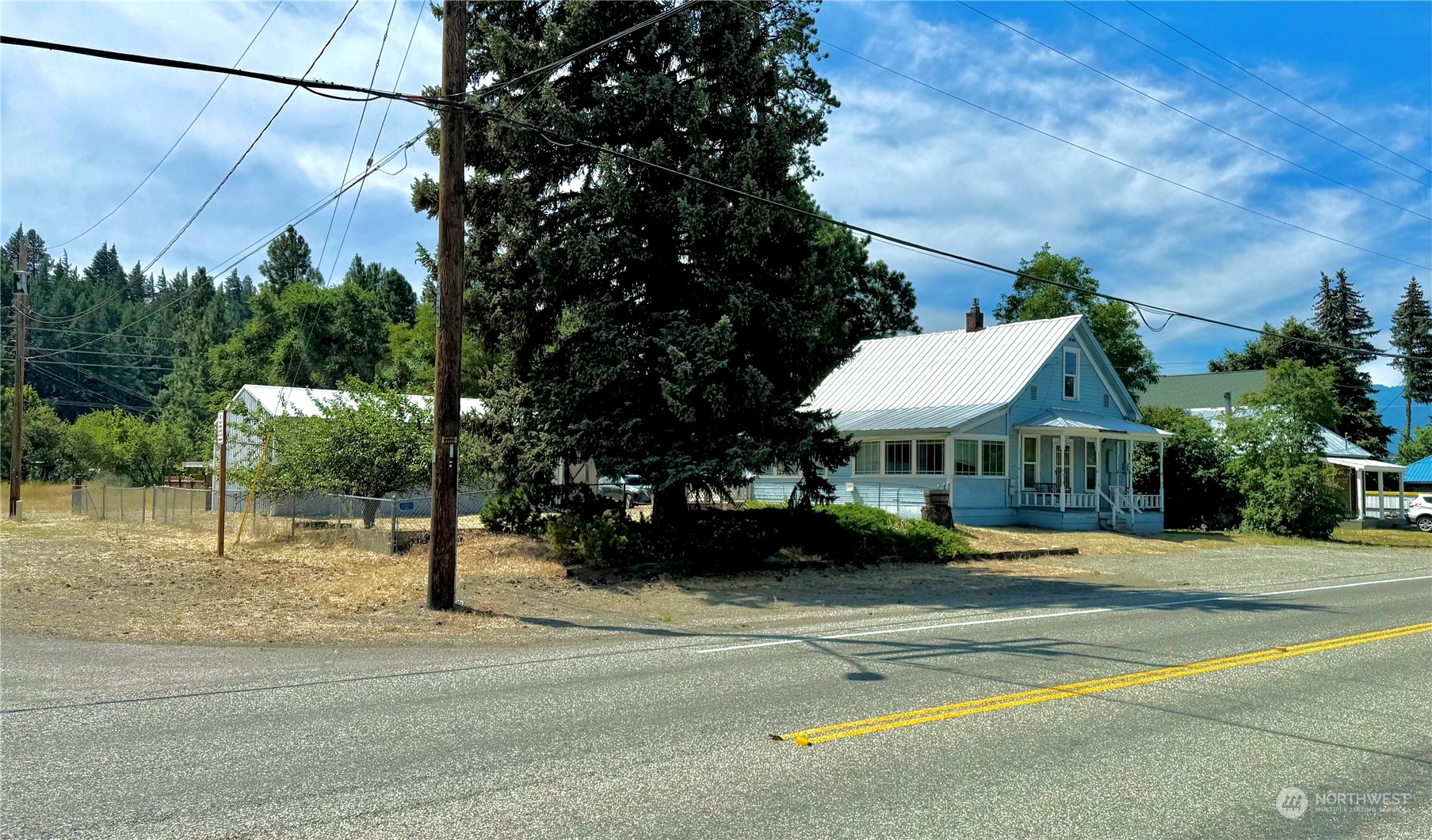 a view of a house with a garden and pathway