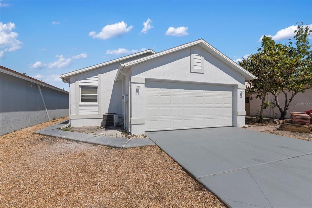 a front view of a house with garage