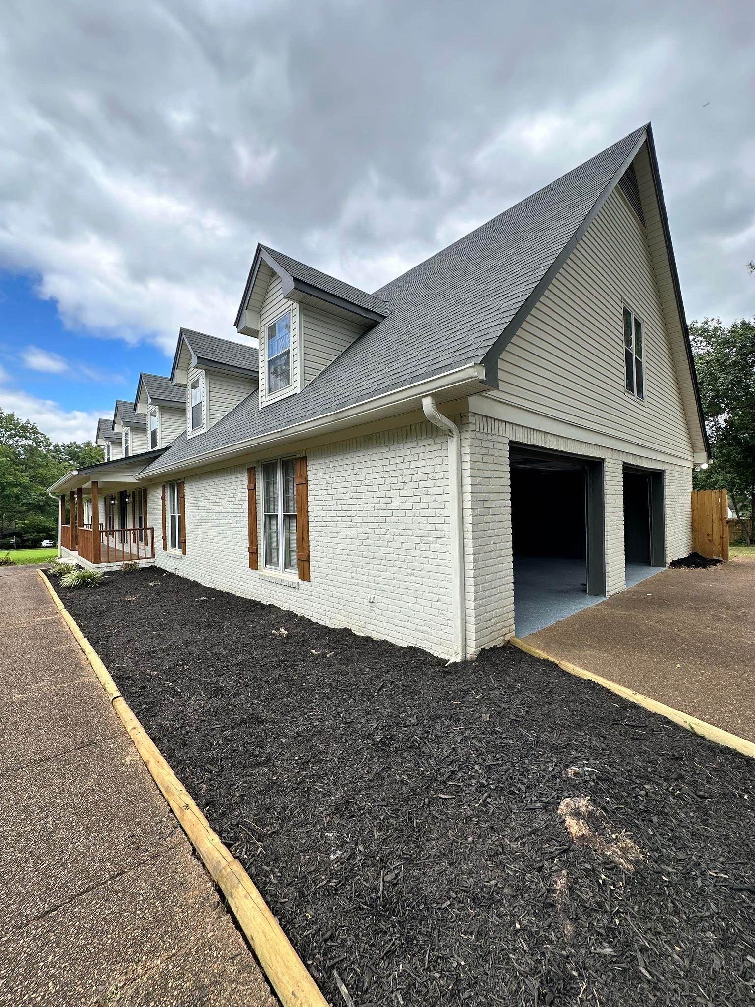 a front view of a house with yard