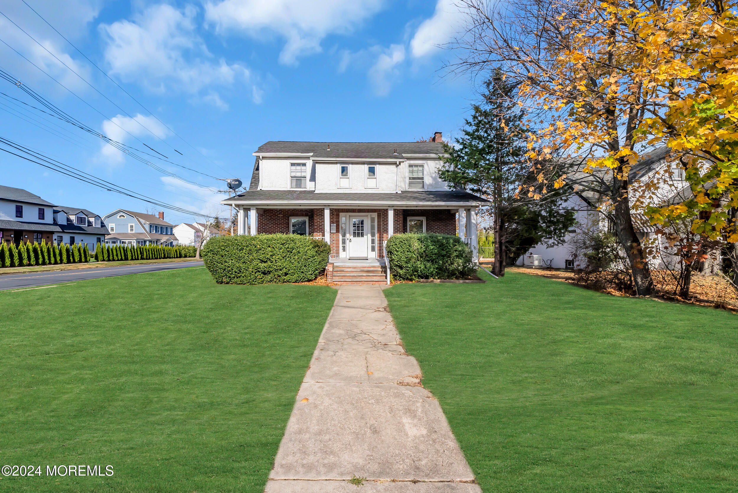 a front view of a house with a garden