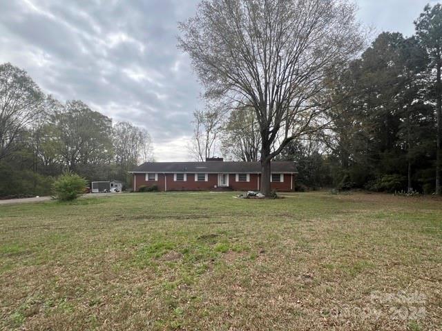 a view of a big yard with a house