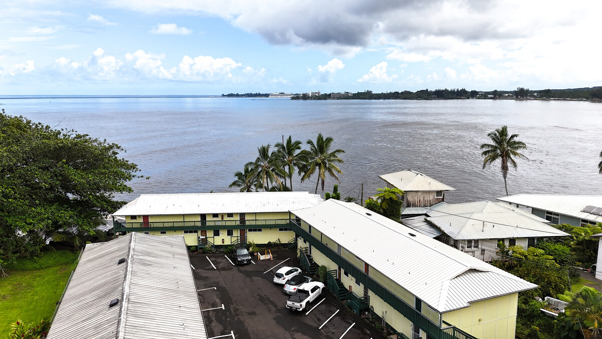 Direct access to HIlo Bay and a quick walk to town make this sweet condo a real find! Unit 222 is upstairs on the building to the right.