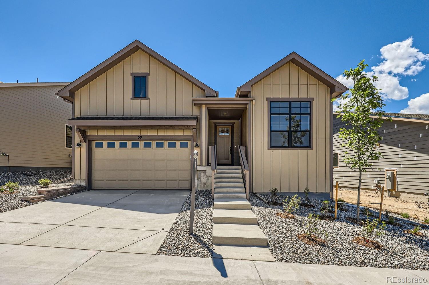 a front view of a house with a garage