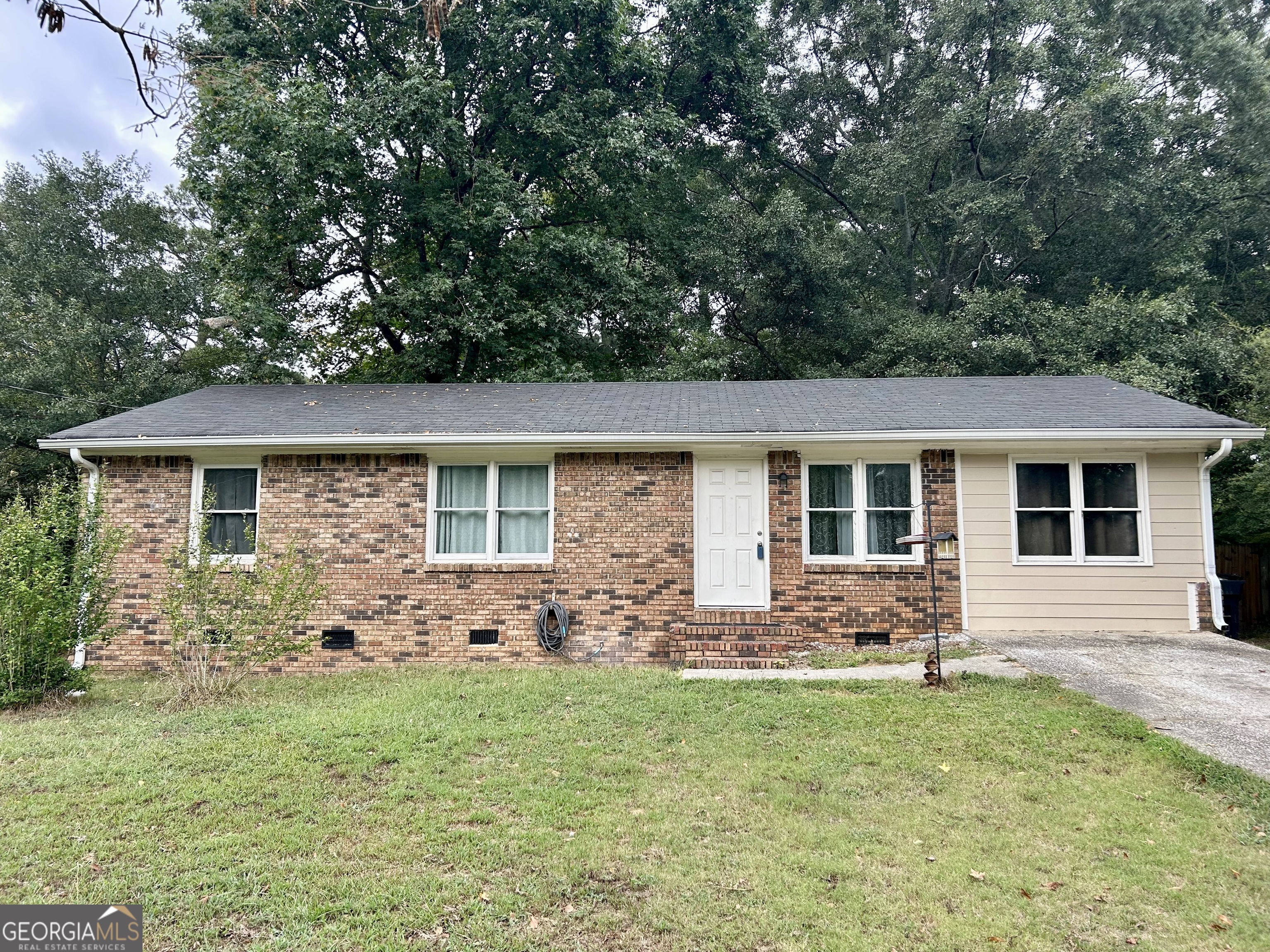 front view of a house with a yard