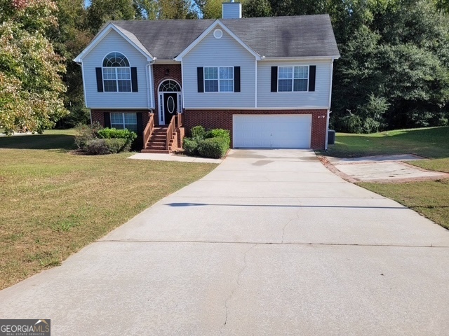 a front view of a house with yard