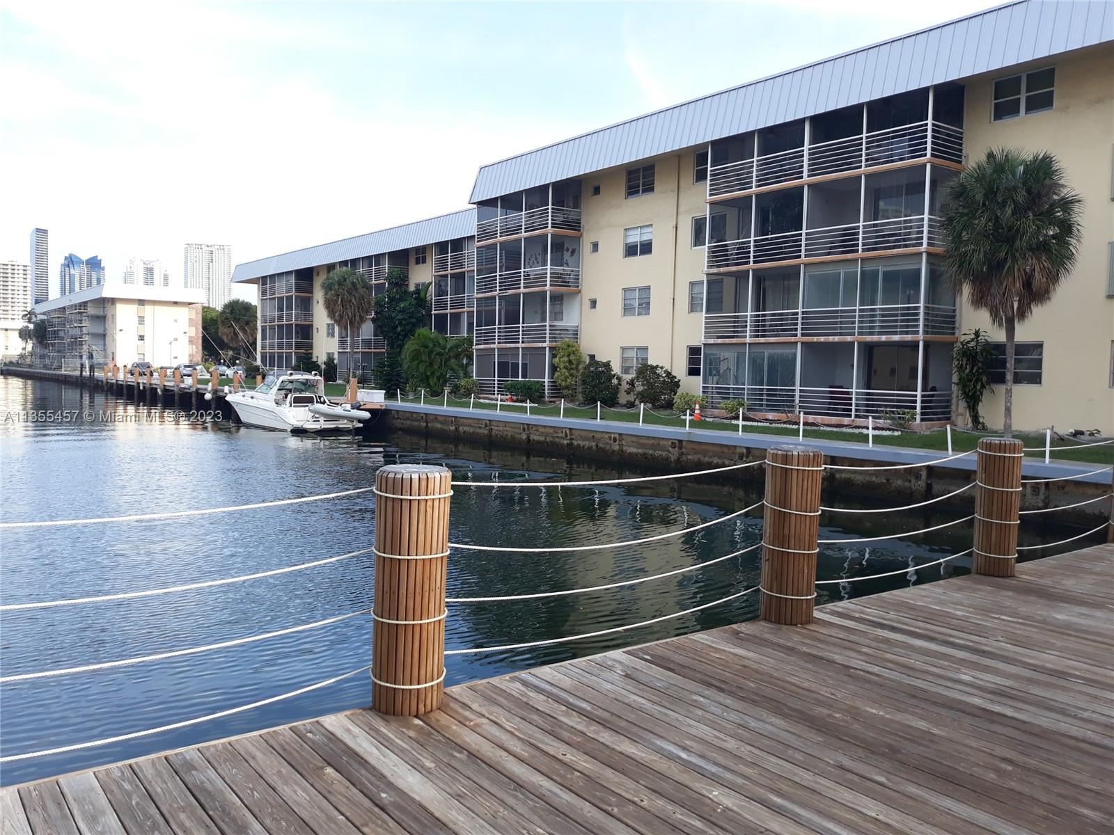 a view of outdoor space with wooden floor and outdoor seating