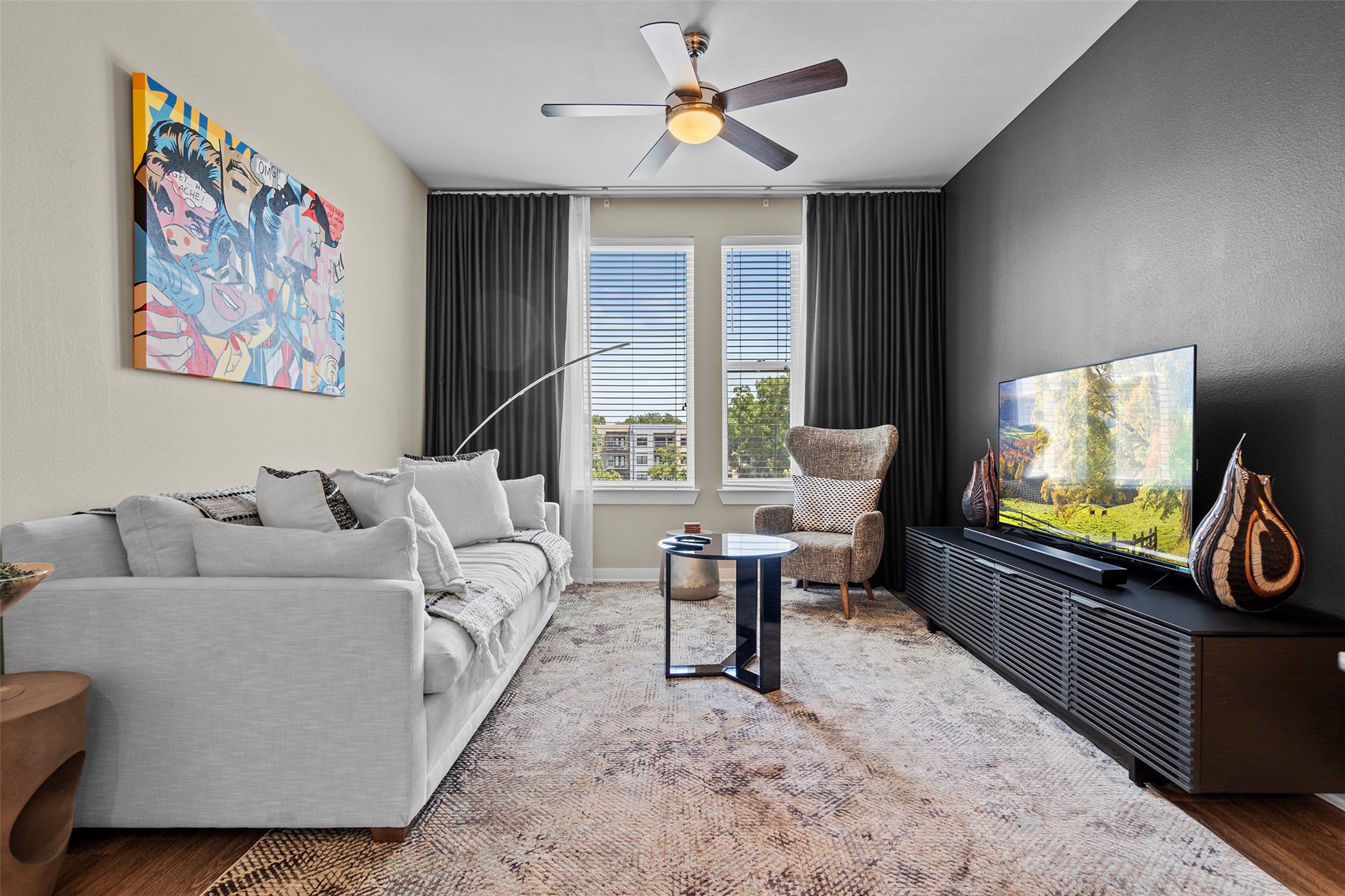 a living room with furniture and a flat screen tv