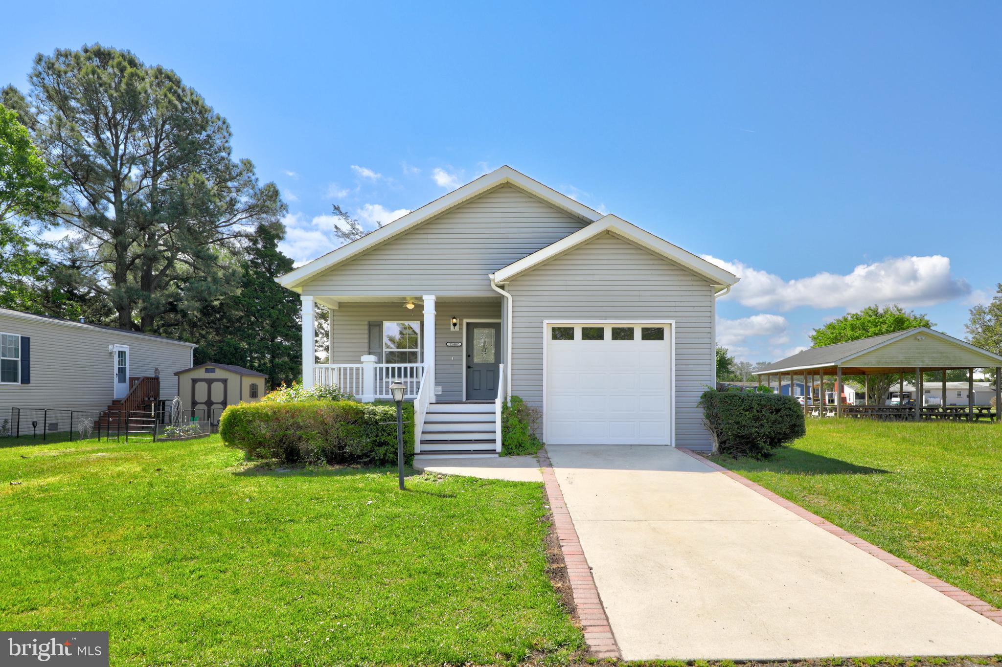 a view of a house with a yard and plants