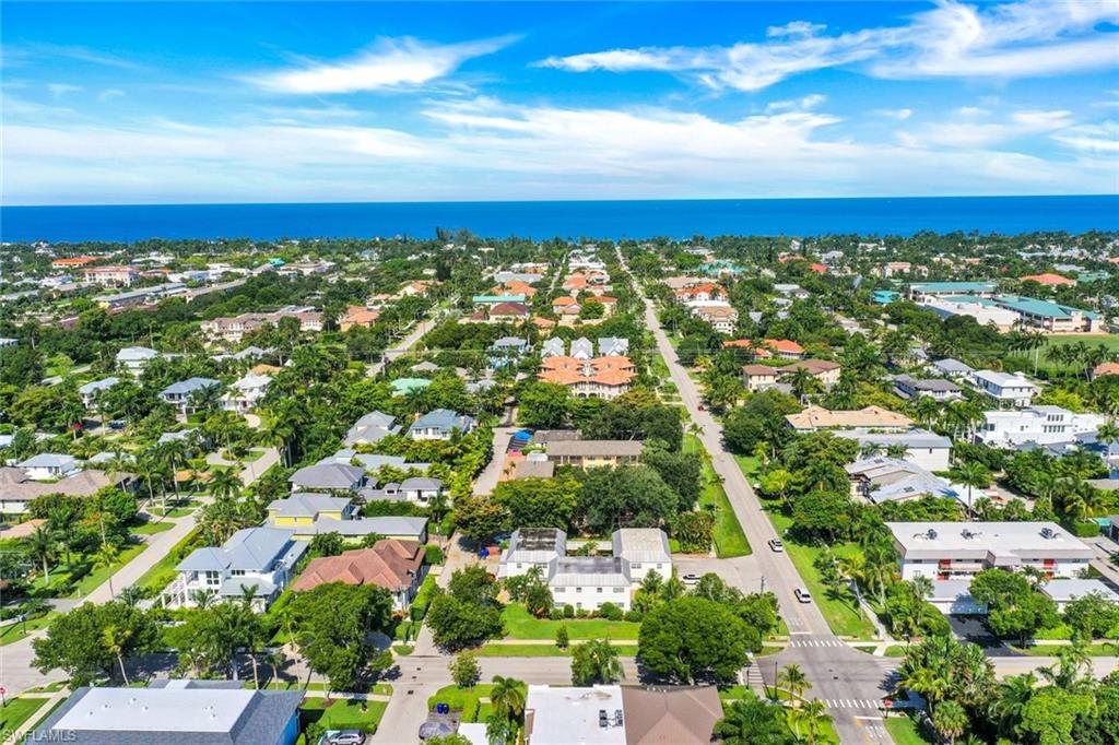 an aerial view of residential building with green space