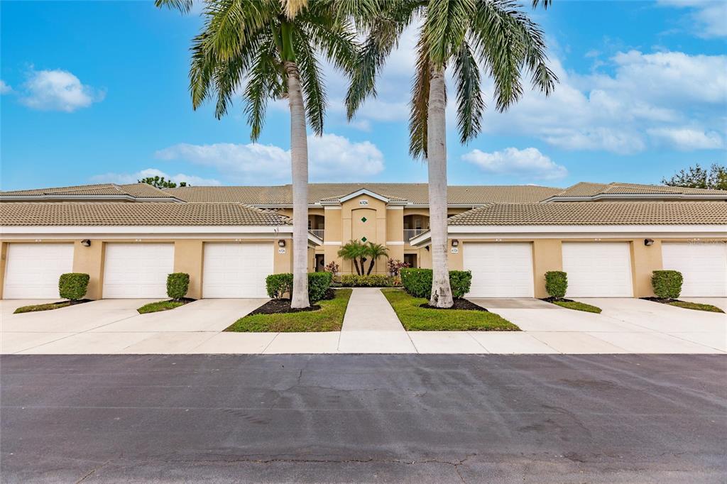 front view of house with palm trees