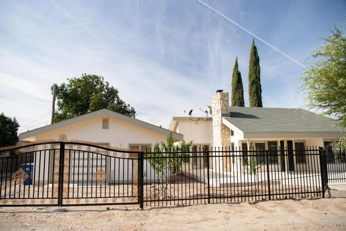 a view of a wrought iron fences in front of house