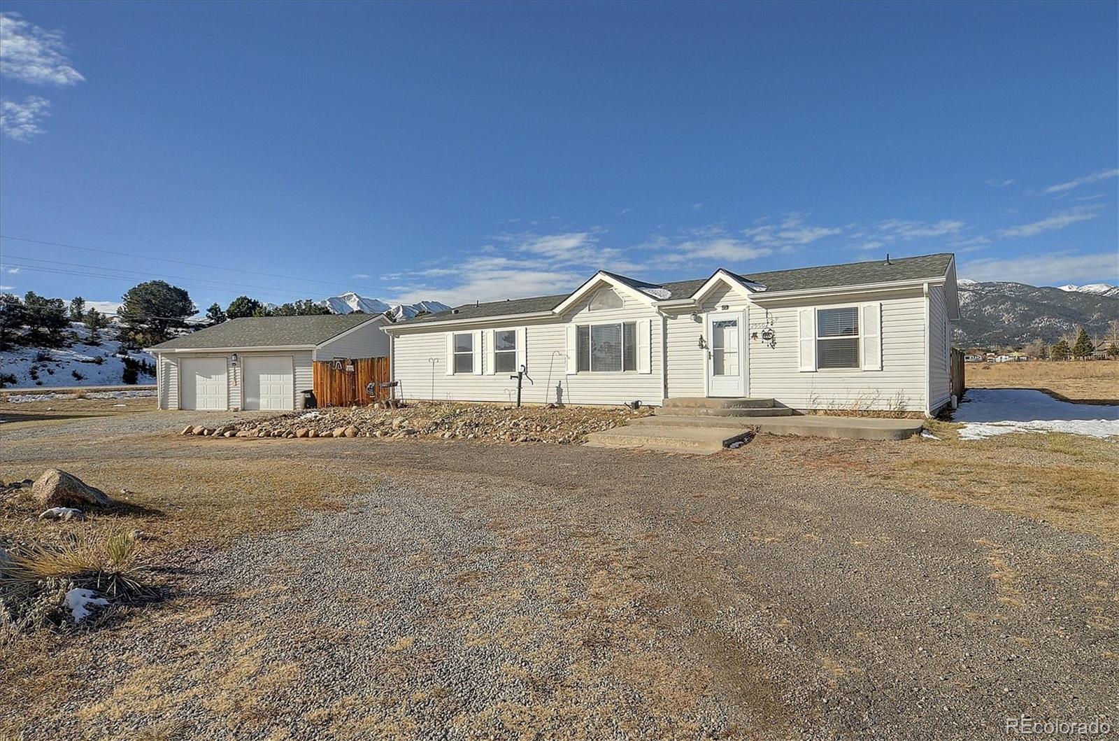 a view of a house with a backyard