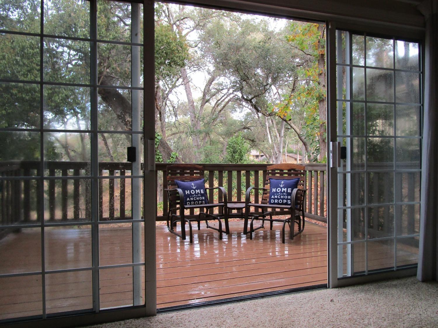 a view of a chairs and table in the patio